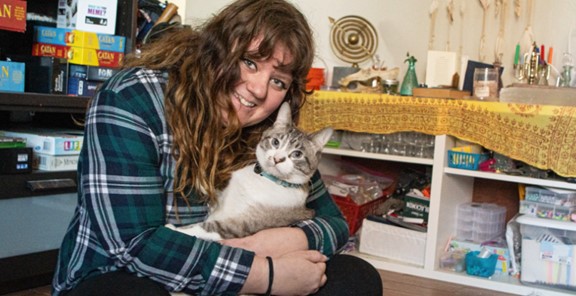 a pet owner reunited with their cat, Pet Disaster Preparedness